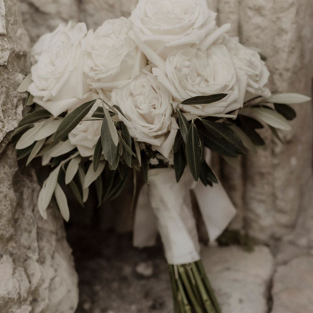Simple round white rose wedding bouquet 