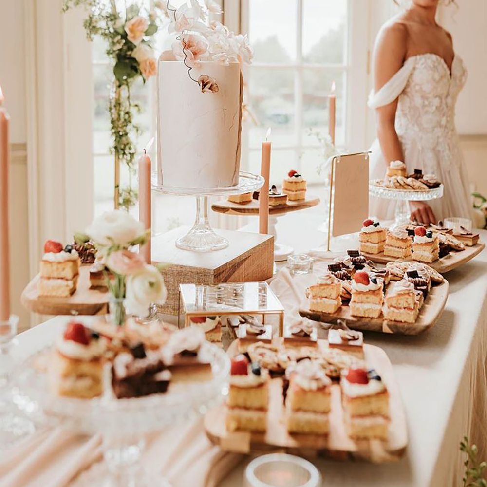 Romantic and elegant wedding theme with dessert table including millionaire shortbread and cakes 