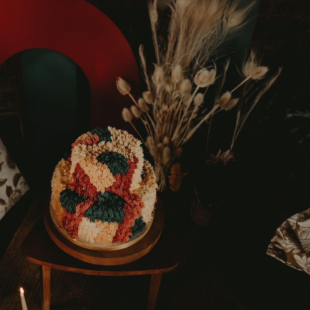 70s shag pile inspired wedding cake in different coloured buttercream icing 