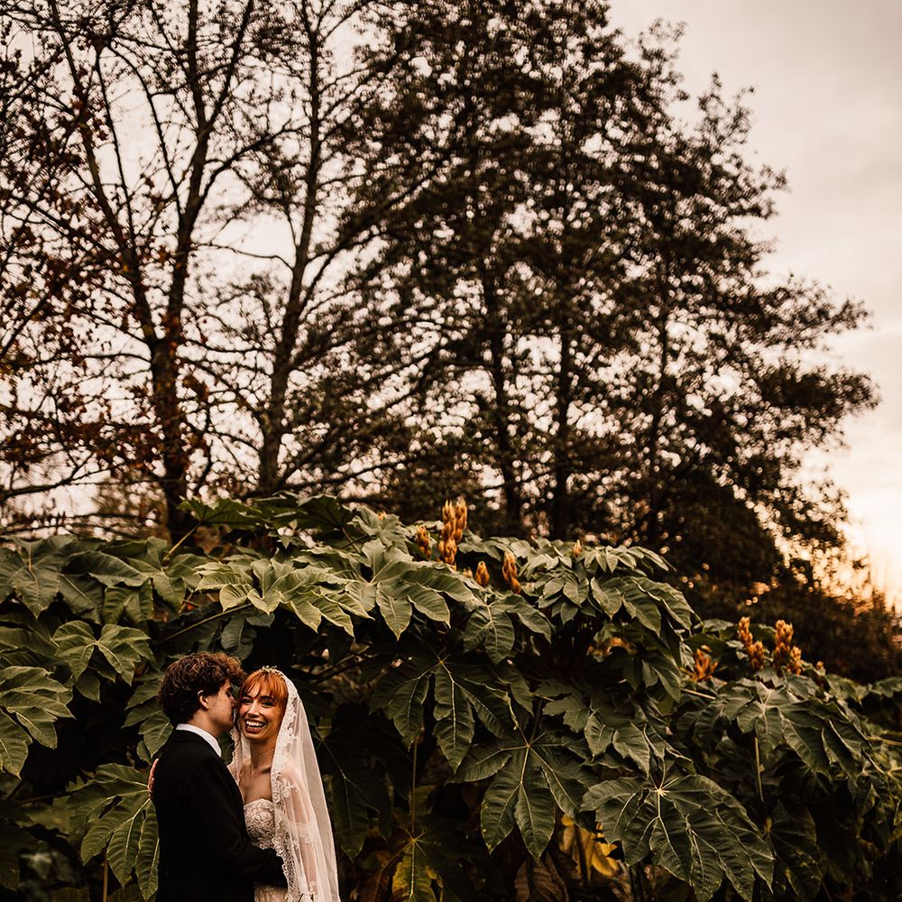 Bride and groom share a moment at Oxnead Hall wedding venue