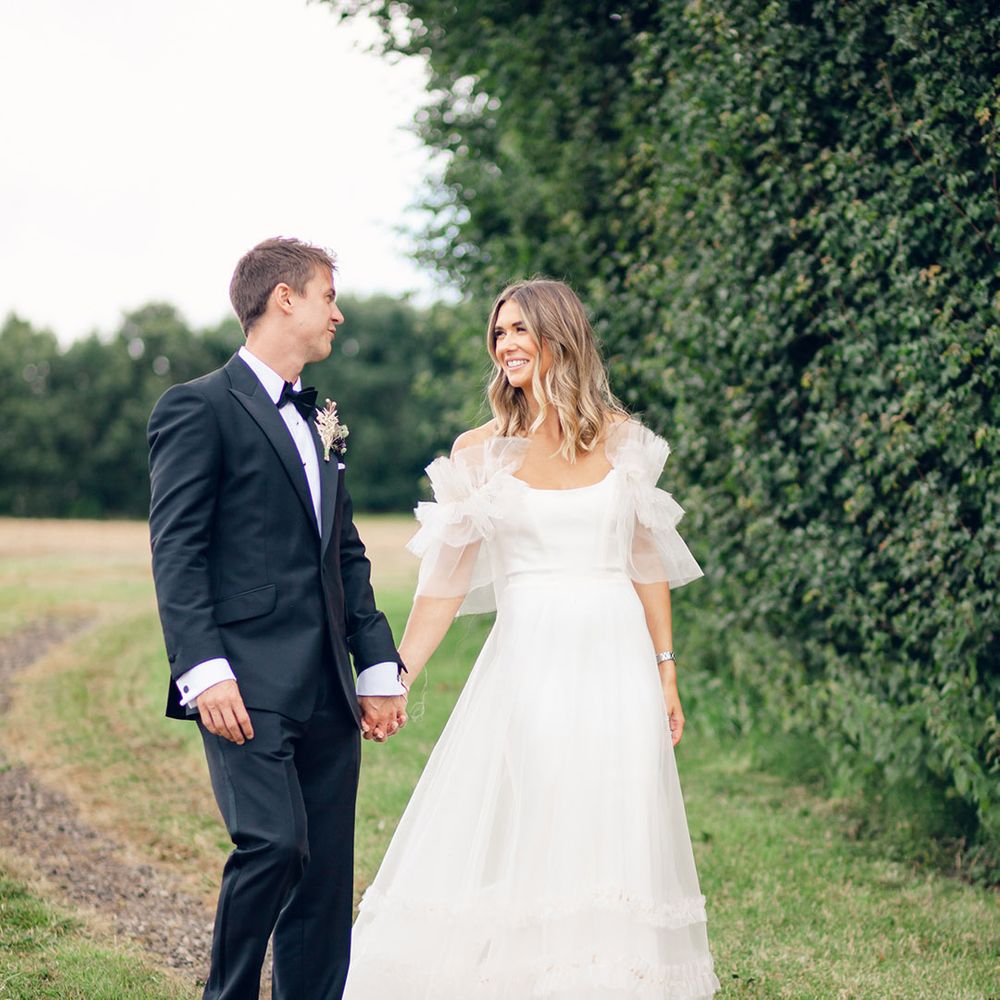Bride in Halfpenny London wedding dress with groom in tuxedo for black tie wedding