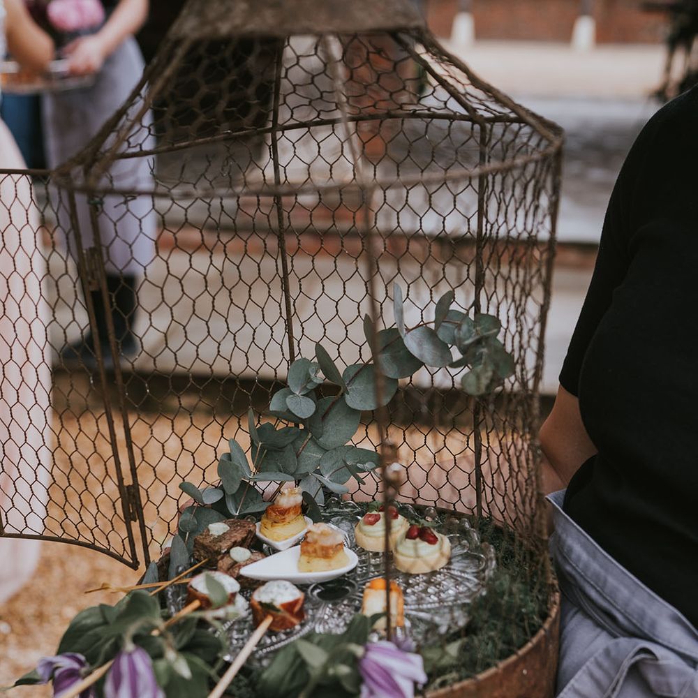 Cages with hors d'oeuvres for vegan, vegetarian and meat eater wedding guests