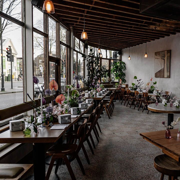 Perilla wedding reception with retro wooden tables and colourful floral arrangements wedding decor 