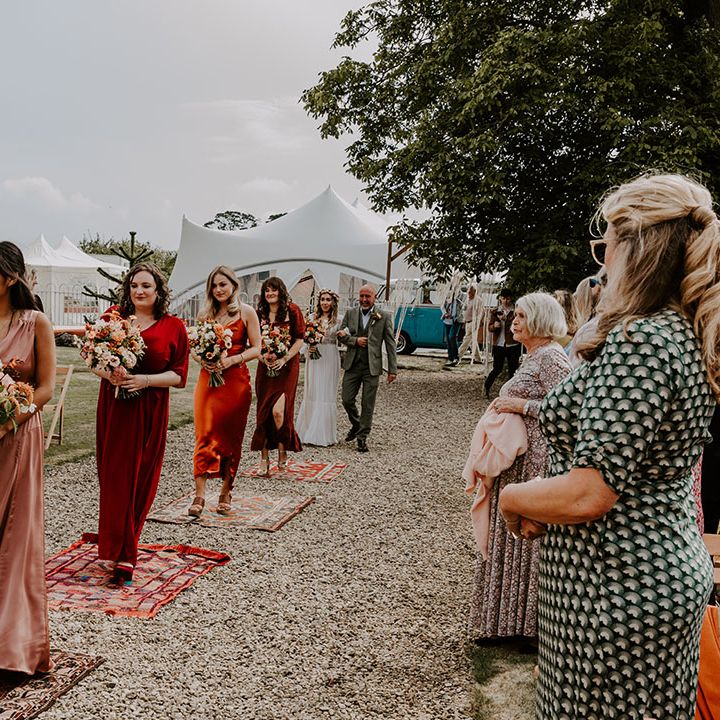 Autumn colour bridesmaid dresses with mismatched styling for boho wedding day outdoors 