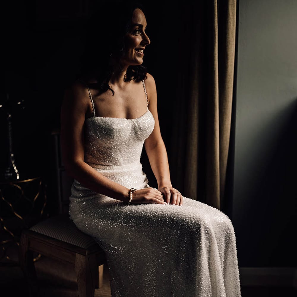 Bride in a gorgeous fitted beaded sparkle wedding dress from Made With Love 