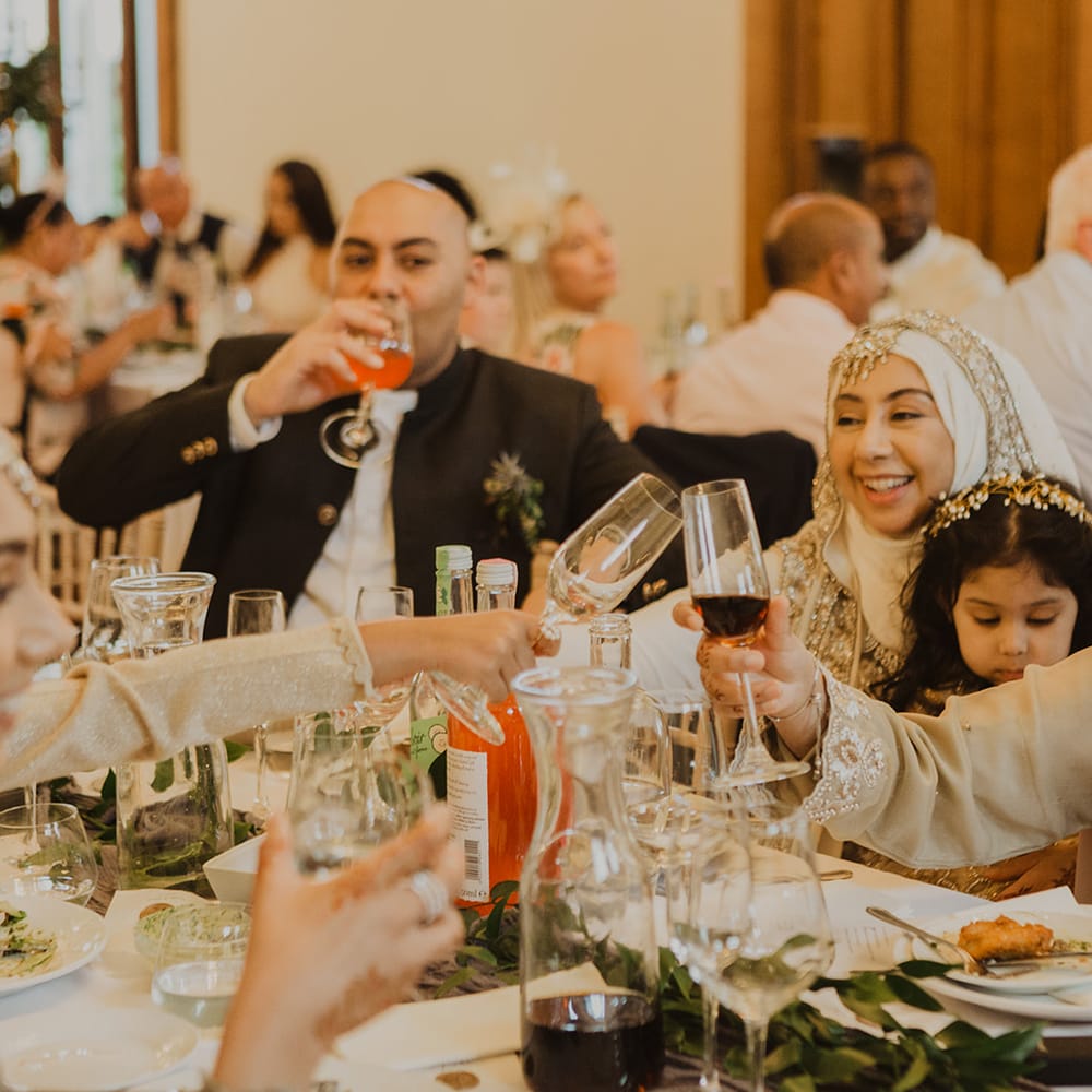 Wedding guests 'cheers' at multicultural wedding 