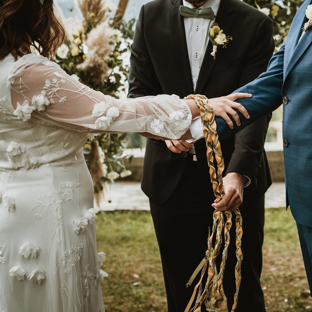 Handfasting wedding ceremony with ribbon 