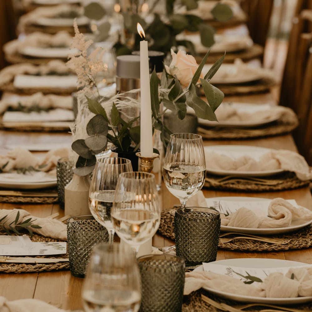 Rustic tablescape complete with woven placemats and greenery throughout  | Mark Bamforth Photography