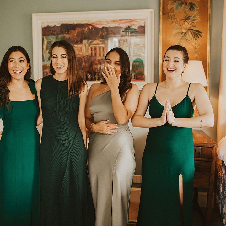 Bridesmaids see the bride for the first time on wedding day