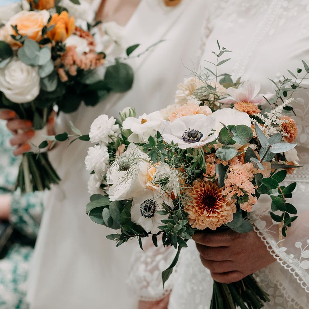 Floral bouquets filled with white and orange blooms