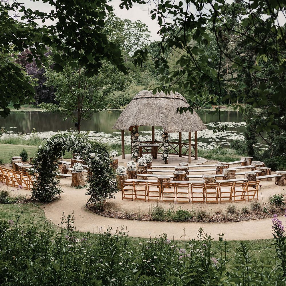 Outdoor woodland wedding ceremony area at The Orangery in Kent 