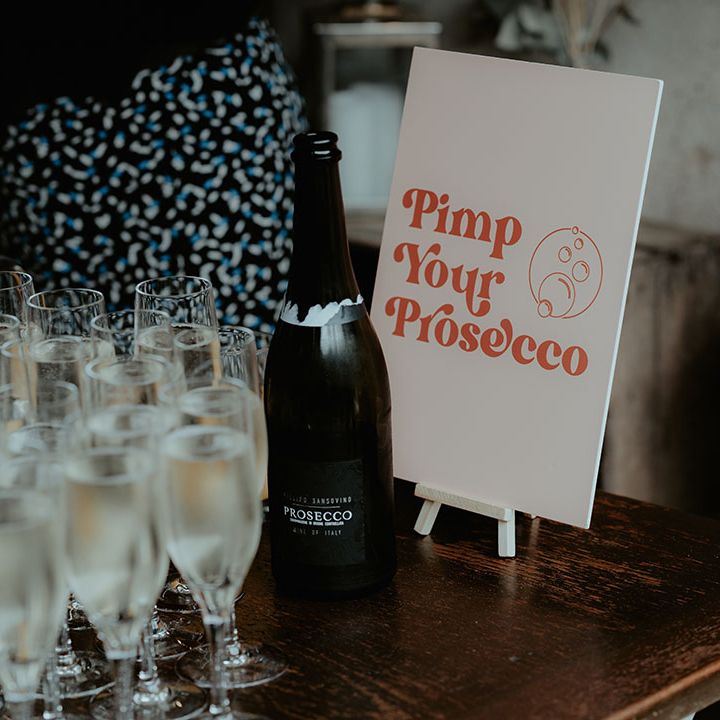 Pimp your Prosecco station for the wedding drinks with a pale pink and orange sign 