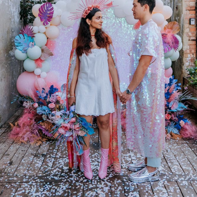 Bride and groom at holographic pastel festival inspiration 