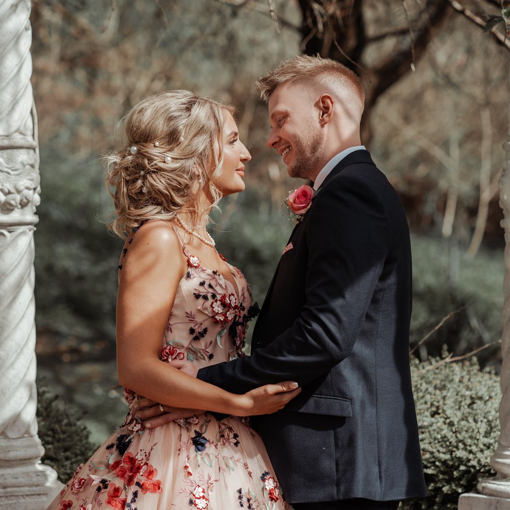 Bride & groom look lovingly at one another on their wedding day