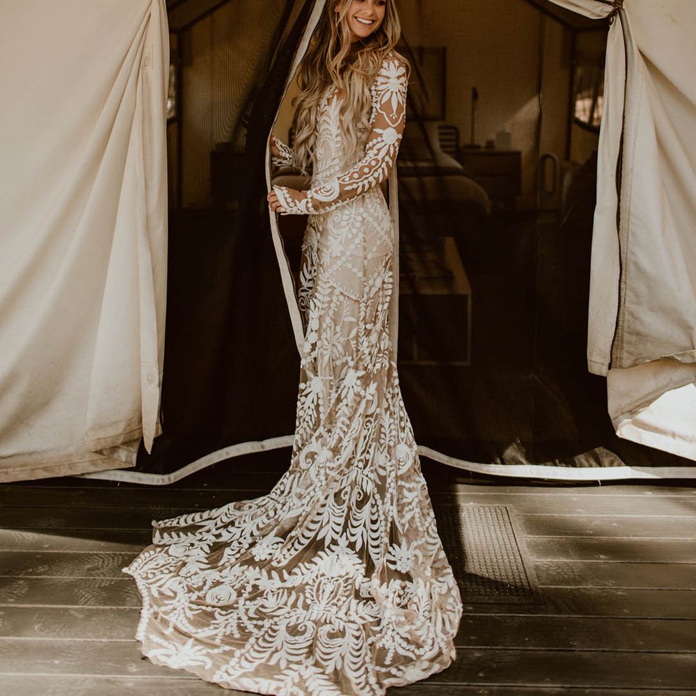 Bride wears boho chic styled wedding gown on her wedding day