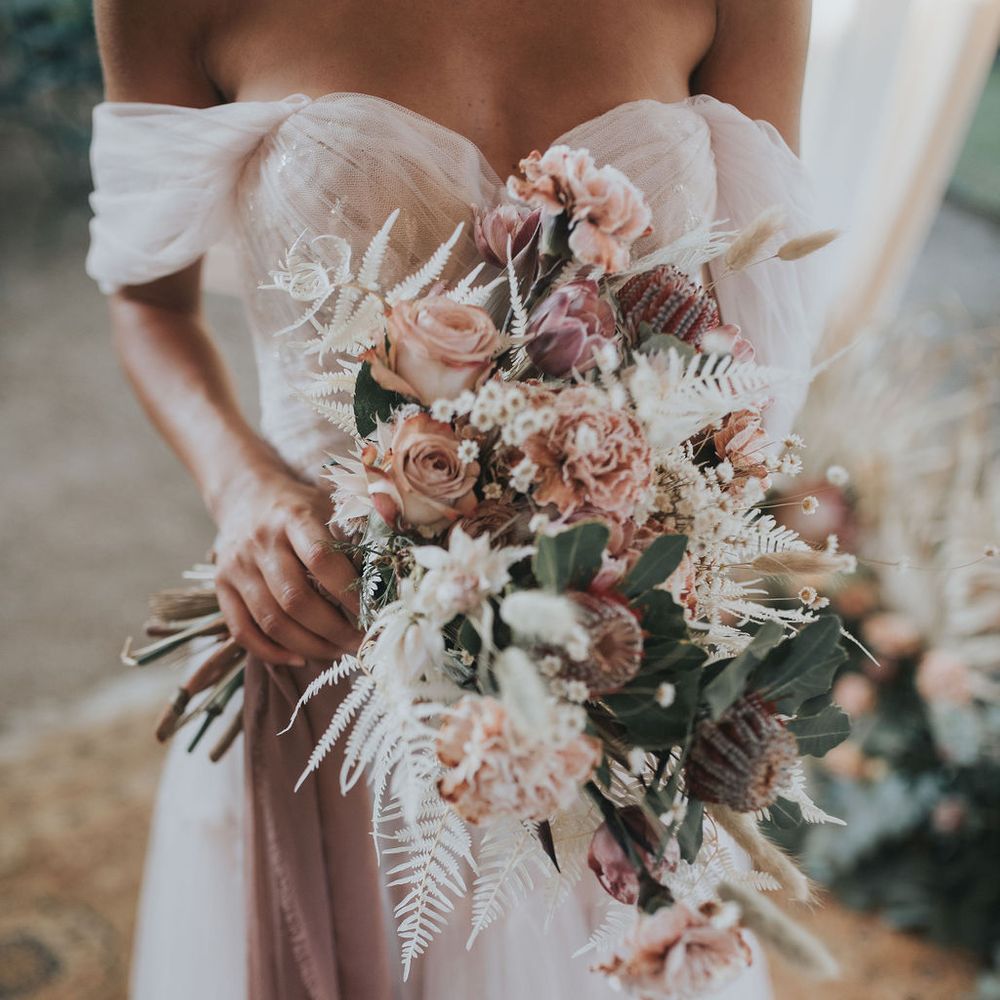 Blush wedding dress and bouquet for intimate Tuscany elopement 