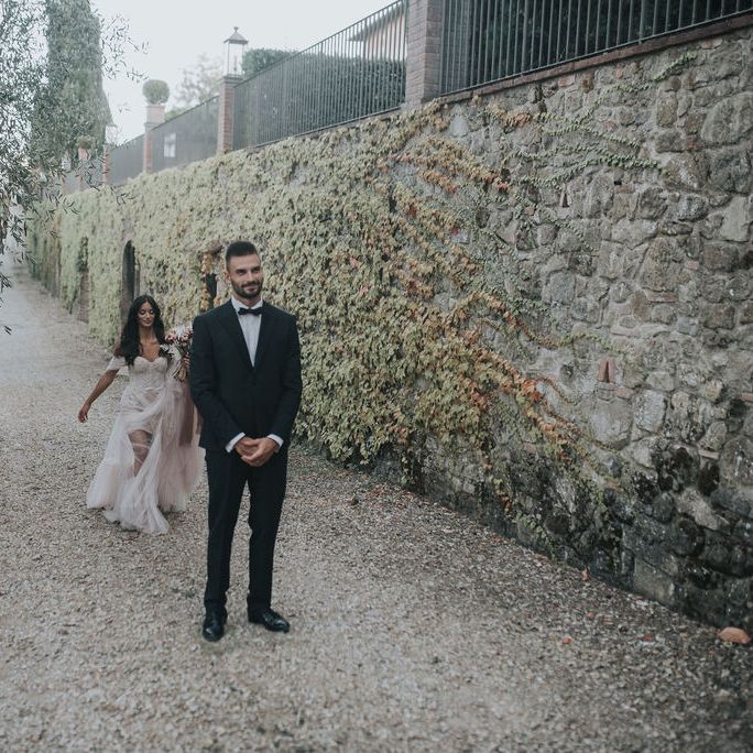 Bride approaching her groom during the first look