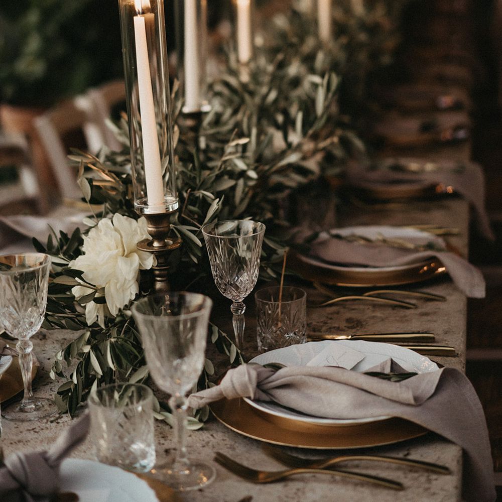 Candlesticks and olive branches bouquets table decorations
