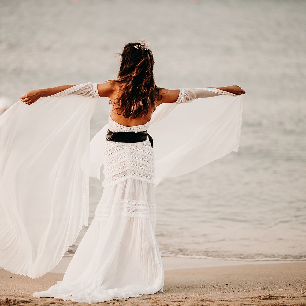 Boho bride in lace wedding dress with black belt at Puglia wedding