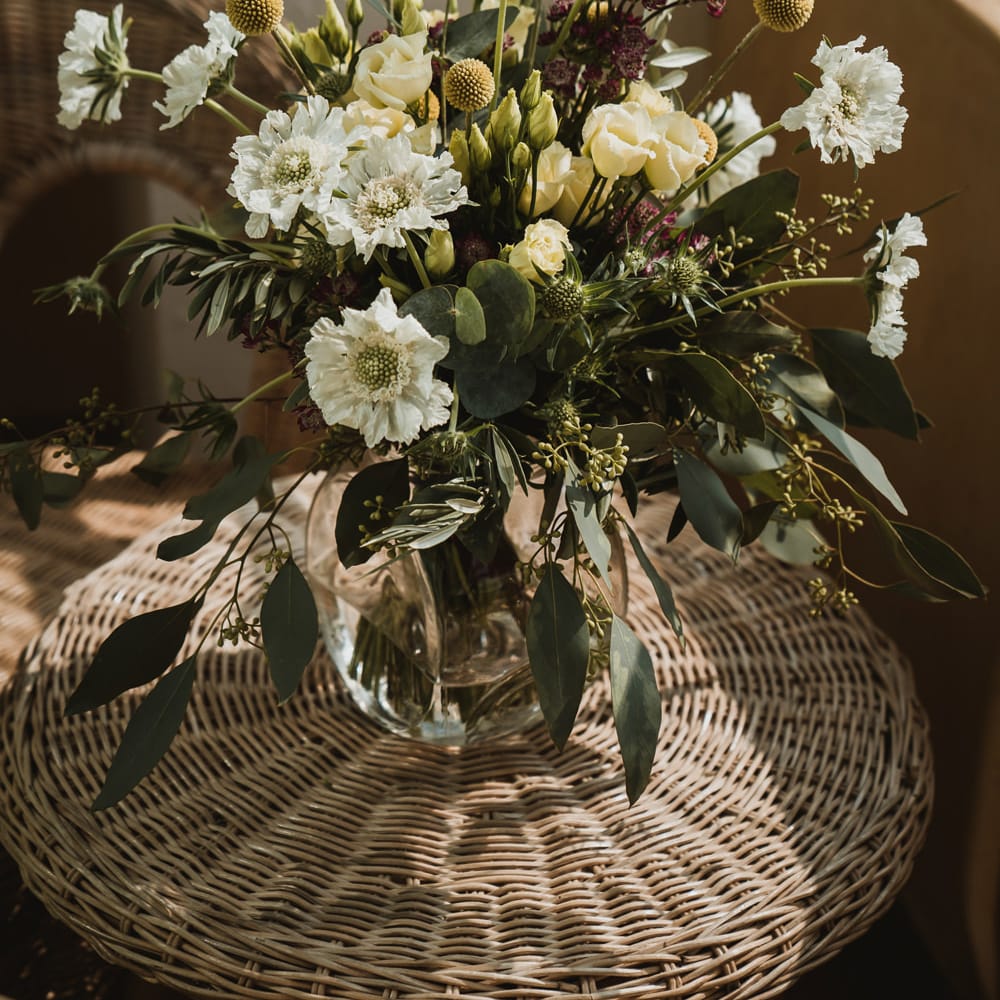 White, green and yellow wedding bouquet with foliage and Billy Buttons 