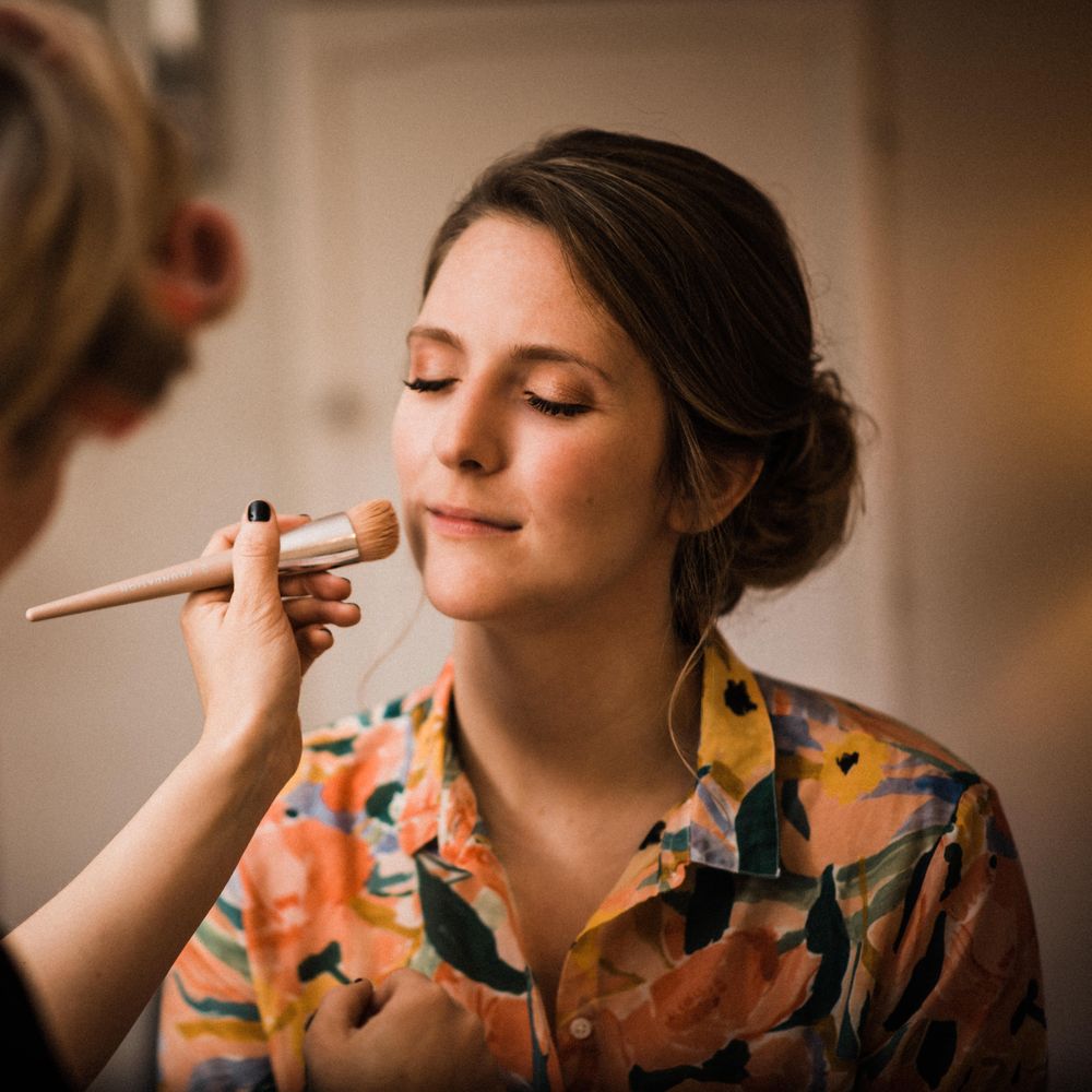 Bride has her makeup done the morning of her wedding