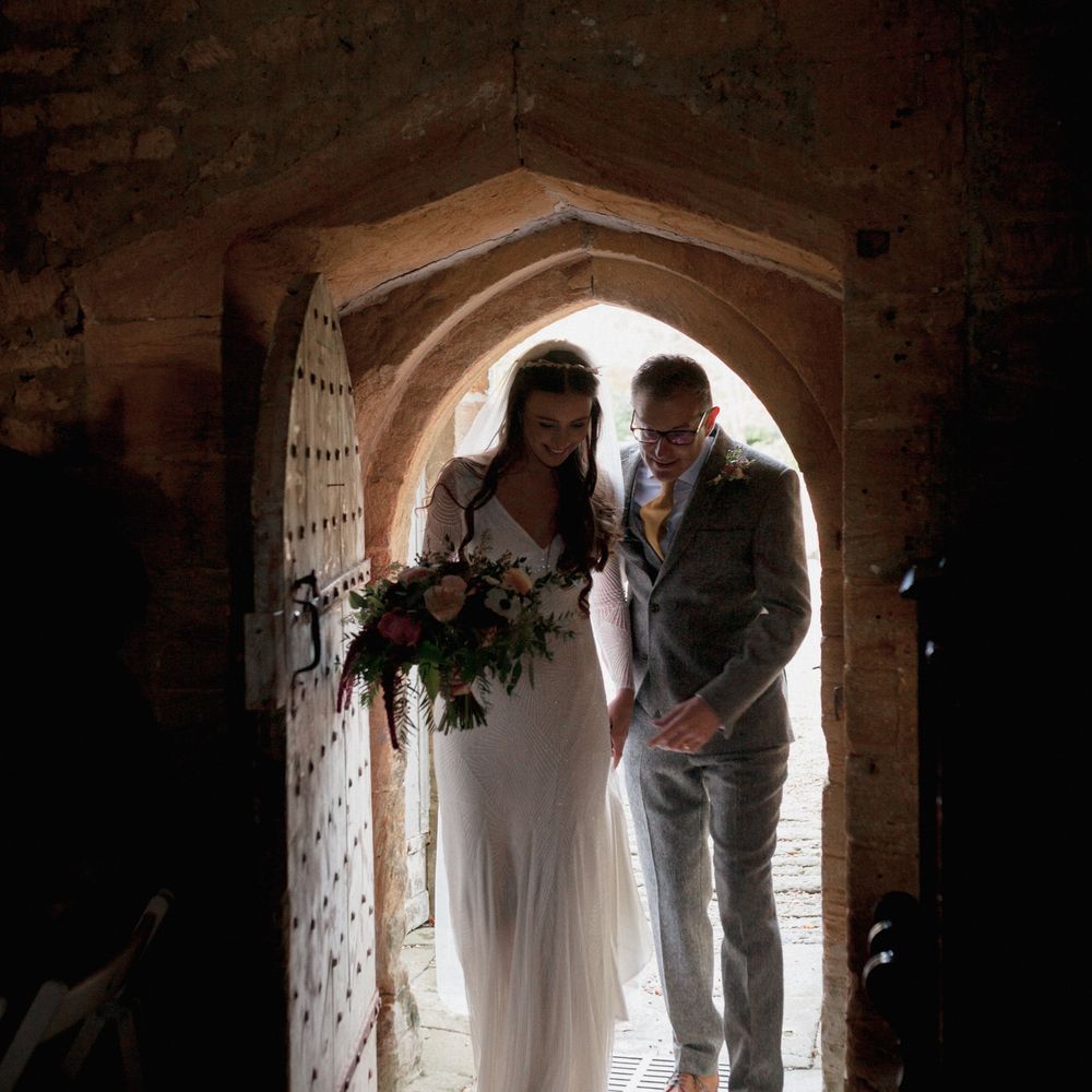 Bride to be walking into church with father of the bride 