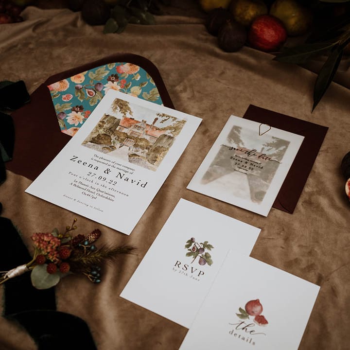 Botanical luxe wedding invites with watercolour paintings of glasshouse venue and paintings of seasonal fruit and vegetables