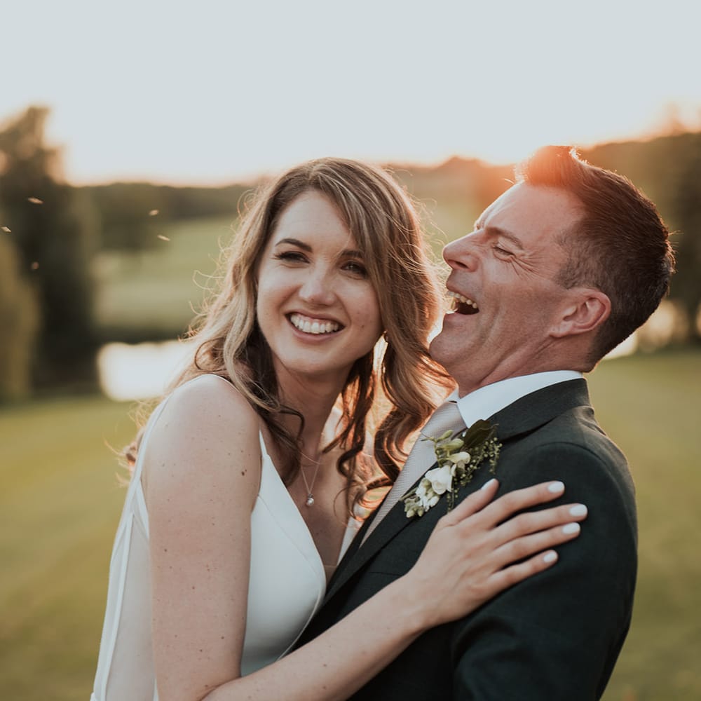 Bride and groom posing for cute couple photos during golden hour 