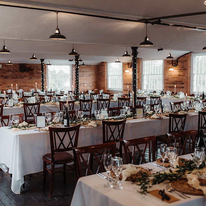 The West Mill in Derbyshire with industrial wedding with boho flowers, pampas grass and fairy light decorations 