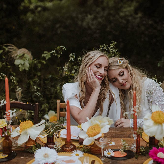 sixties wedding table decor with wildflowers, taper candles, yellow placemats and records 