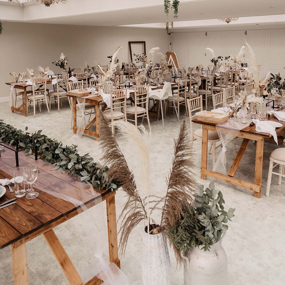 Open and light wedding reception venue complete with dried florals 