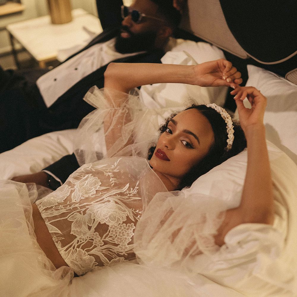 Black bride in an apple headband wearing a sheer tulle and embroidered lace bridal top 