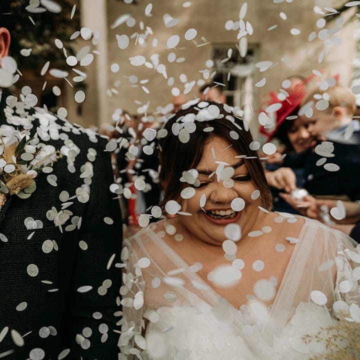 White confetti moment for the bride and groom as they exit from their civil wedding ceremony