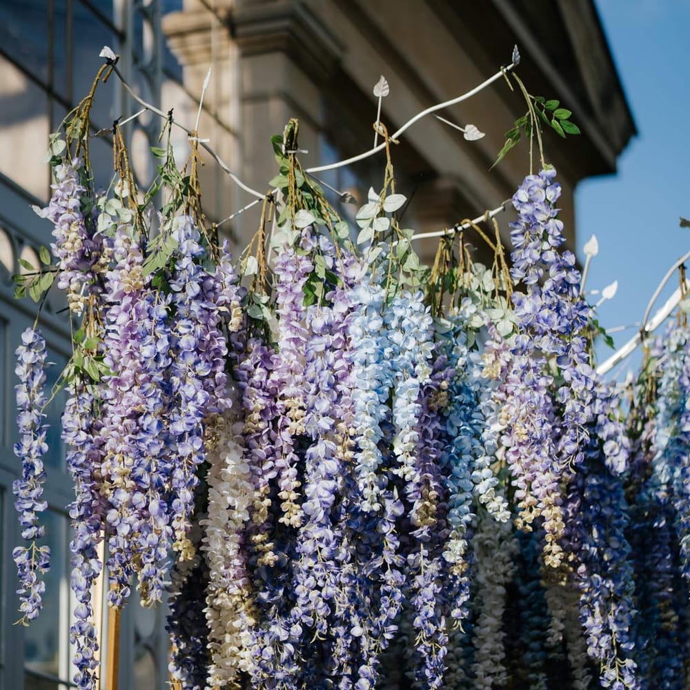 Suspended pastel flower arrangements at Syon Park vow renewal 