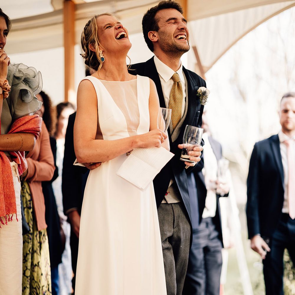 The bride and groom can't stop laughing at their wedding speeches 