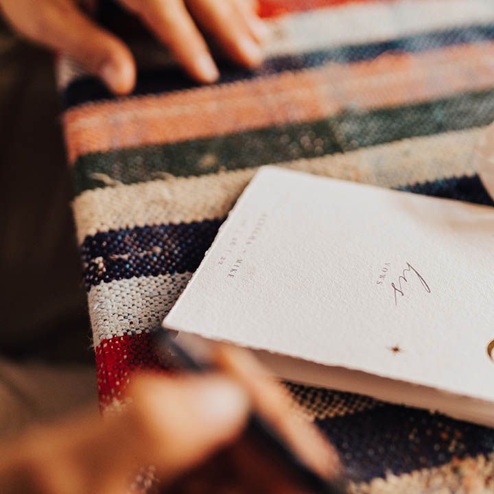 Personalised wedding vow booklet decorated with gold moon motif 