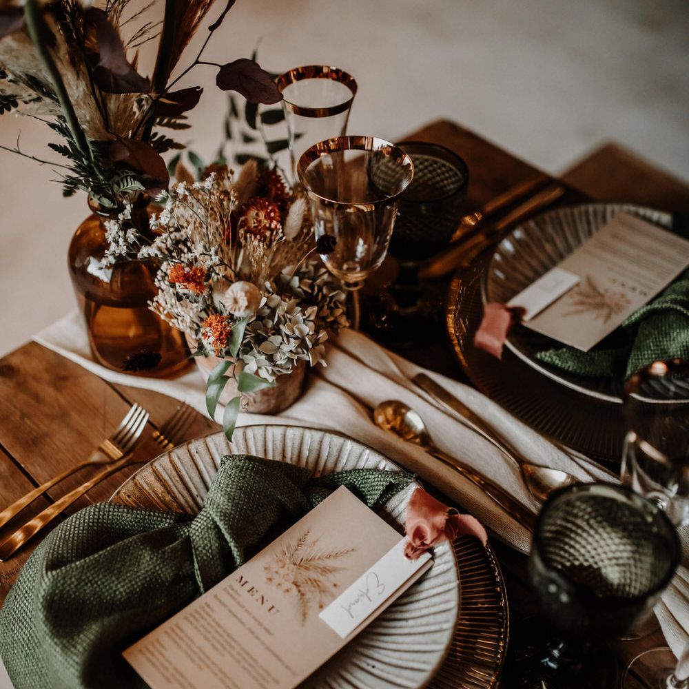 Autumnal wedding table decor with bronze green and gold tones