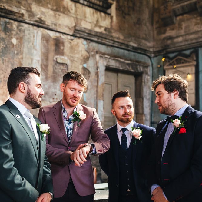 Groomsman checks watch before wedding ceremony