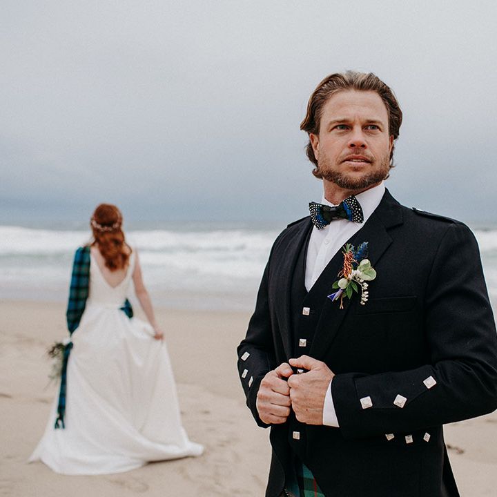 Groom in a black jacket, waistcoat and bow tie with tartan kilt at Big Sur beach