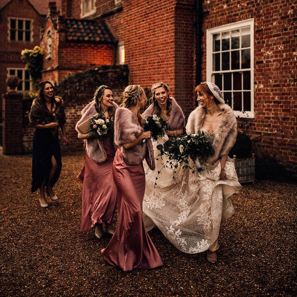 Pink bridesmaid dresses with faux fur wraps