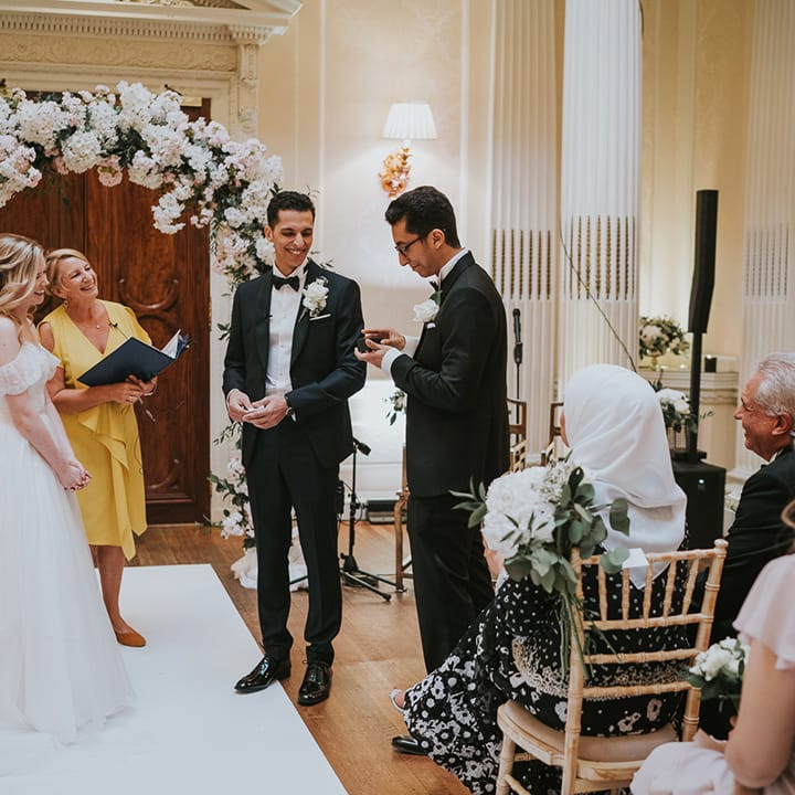 Ring bearer hands over the wedding rings 