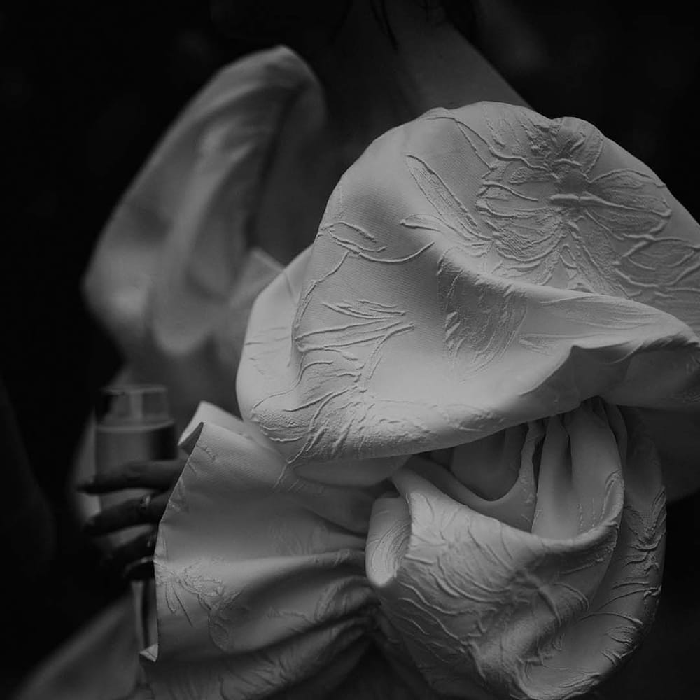 Close up of the brocade detailing on the Jesus Peiro wedding dress 