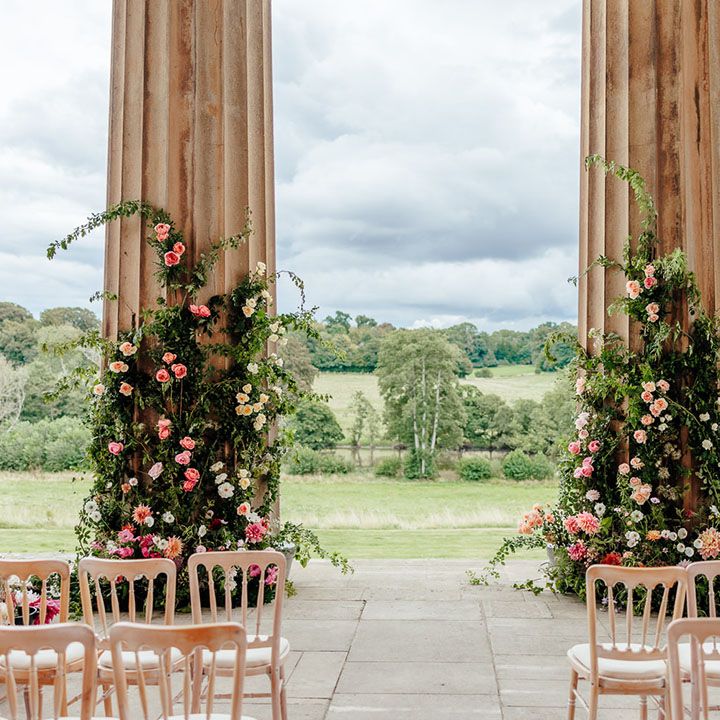 The Grange Hampshire wedding with romantic outdoor wedding ceremony decorated with pink wedding flowers 