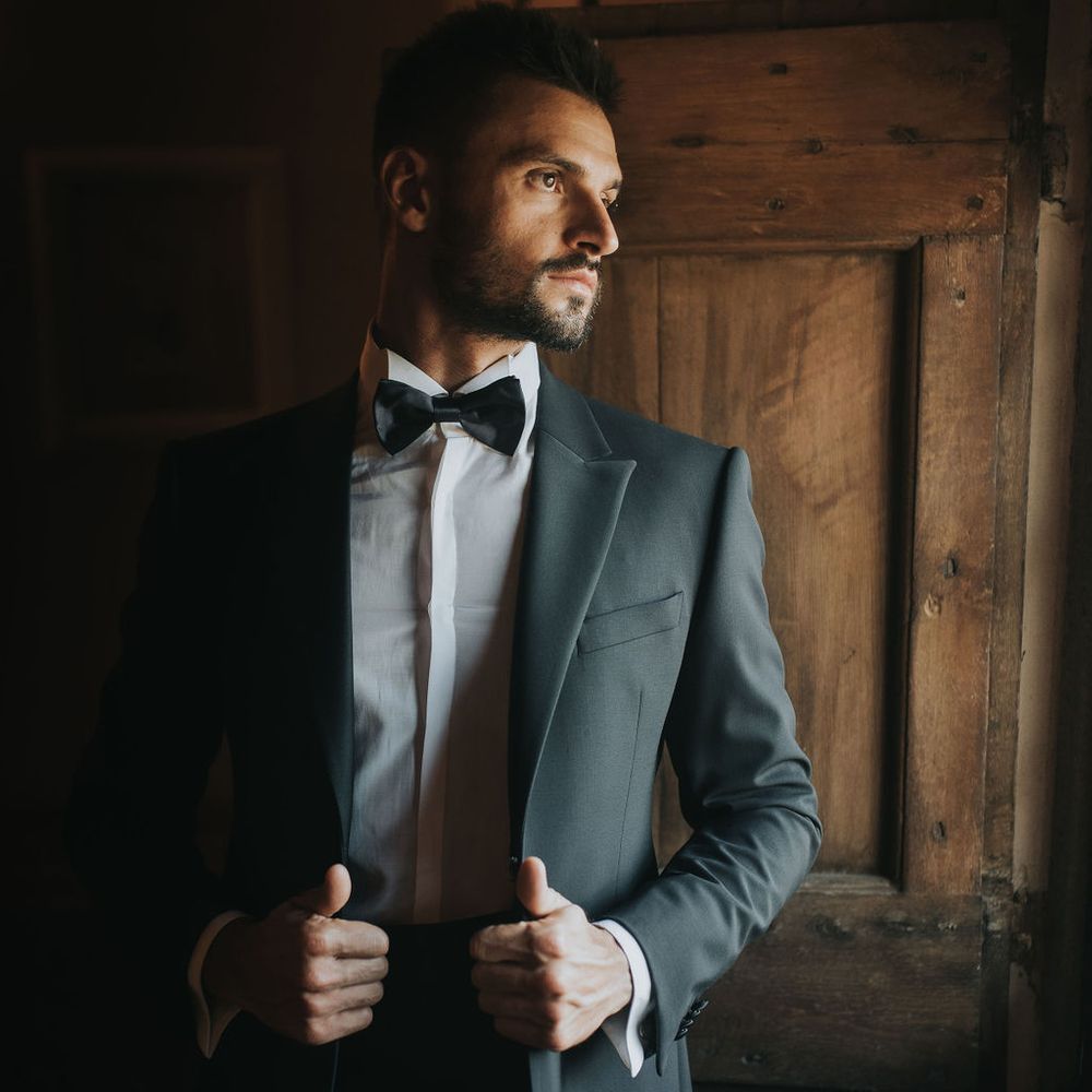 Groom on wedding morning in Armarni suit 