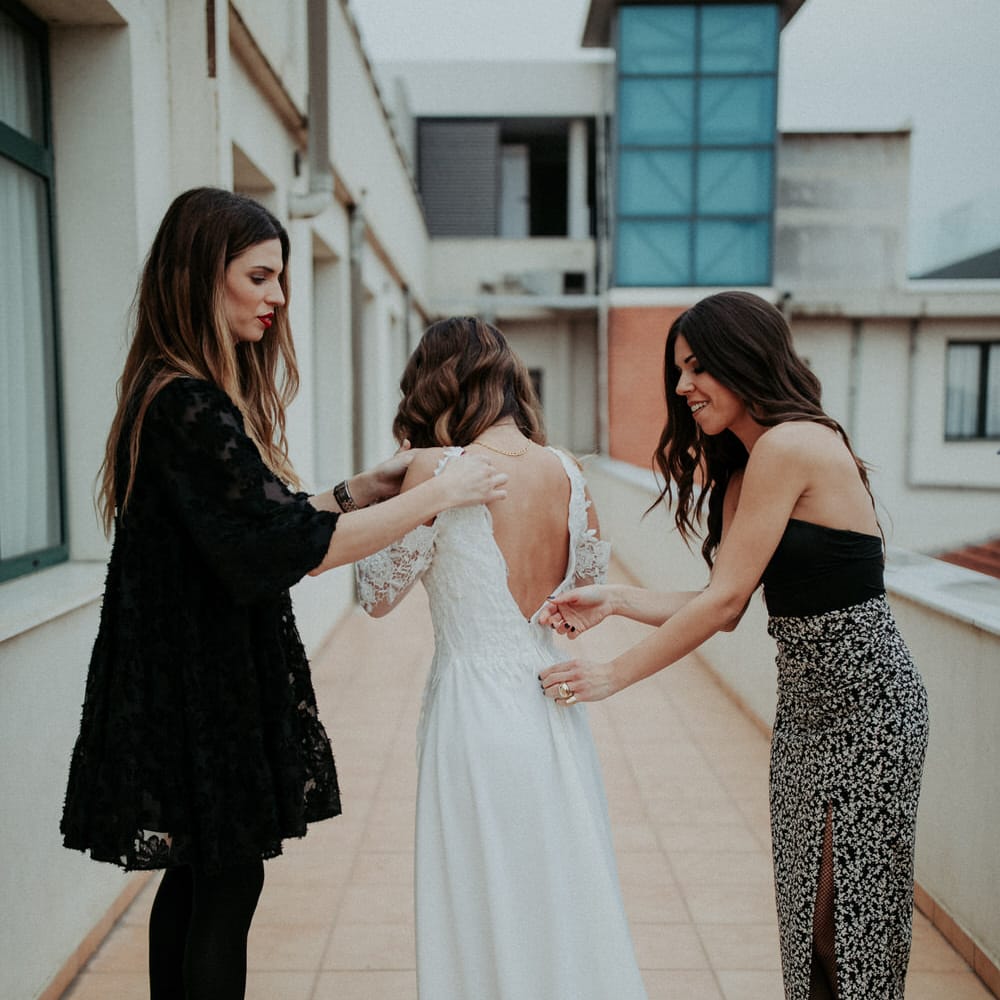 The bride getting ready in a Nadia Rapti gown