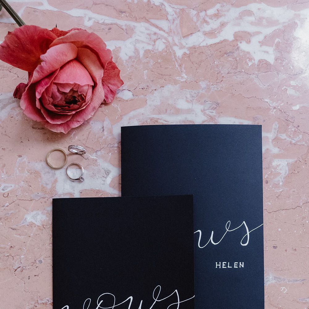 Black wedding vows booklets with silver calligraphy by Lettera.Etc