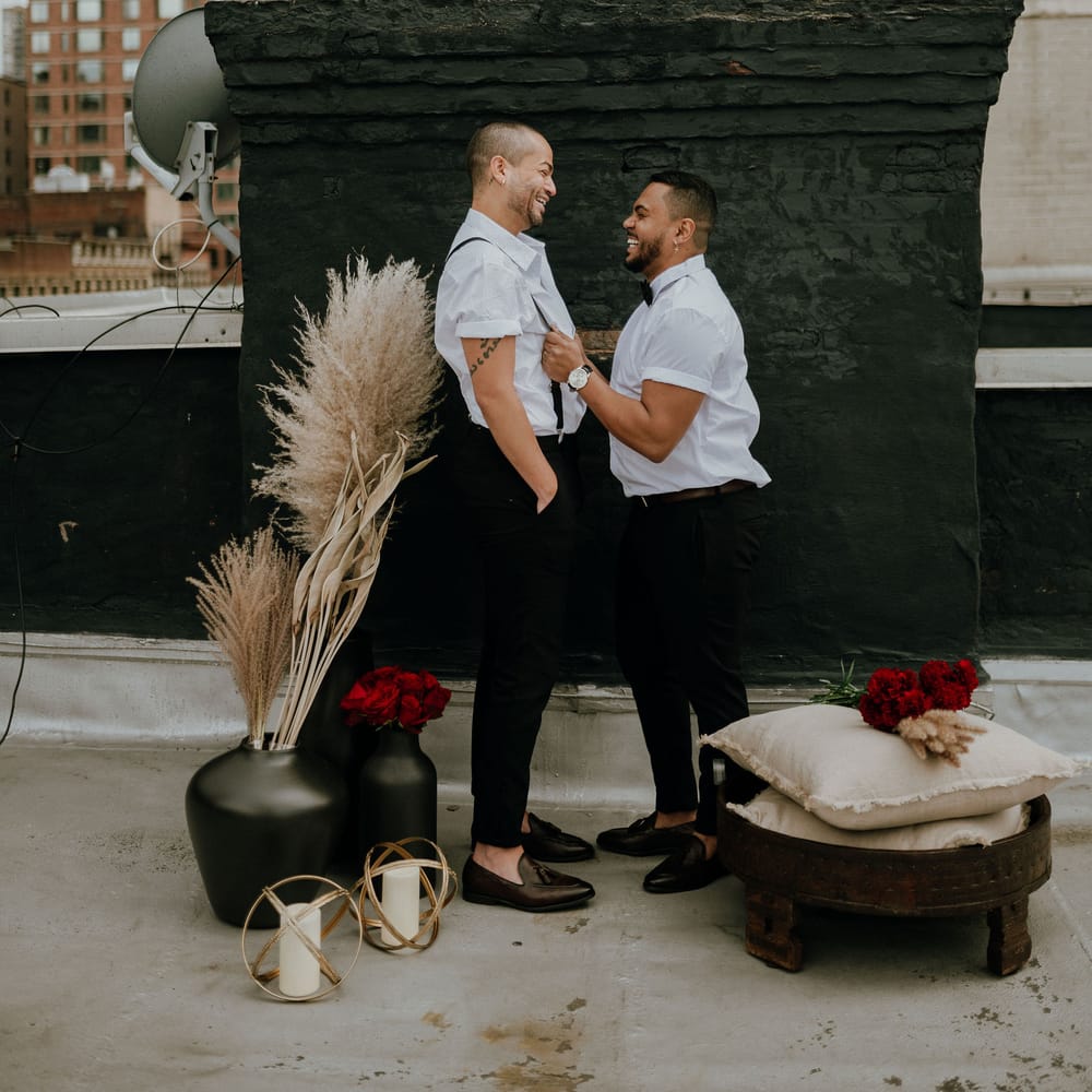 Pampas grass and red rose decor at intimate elopement