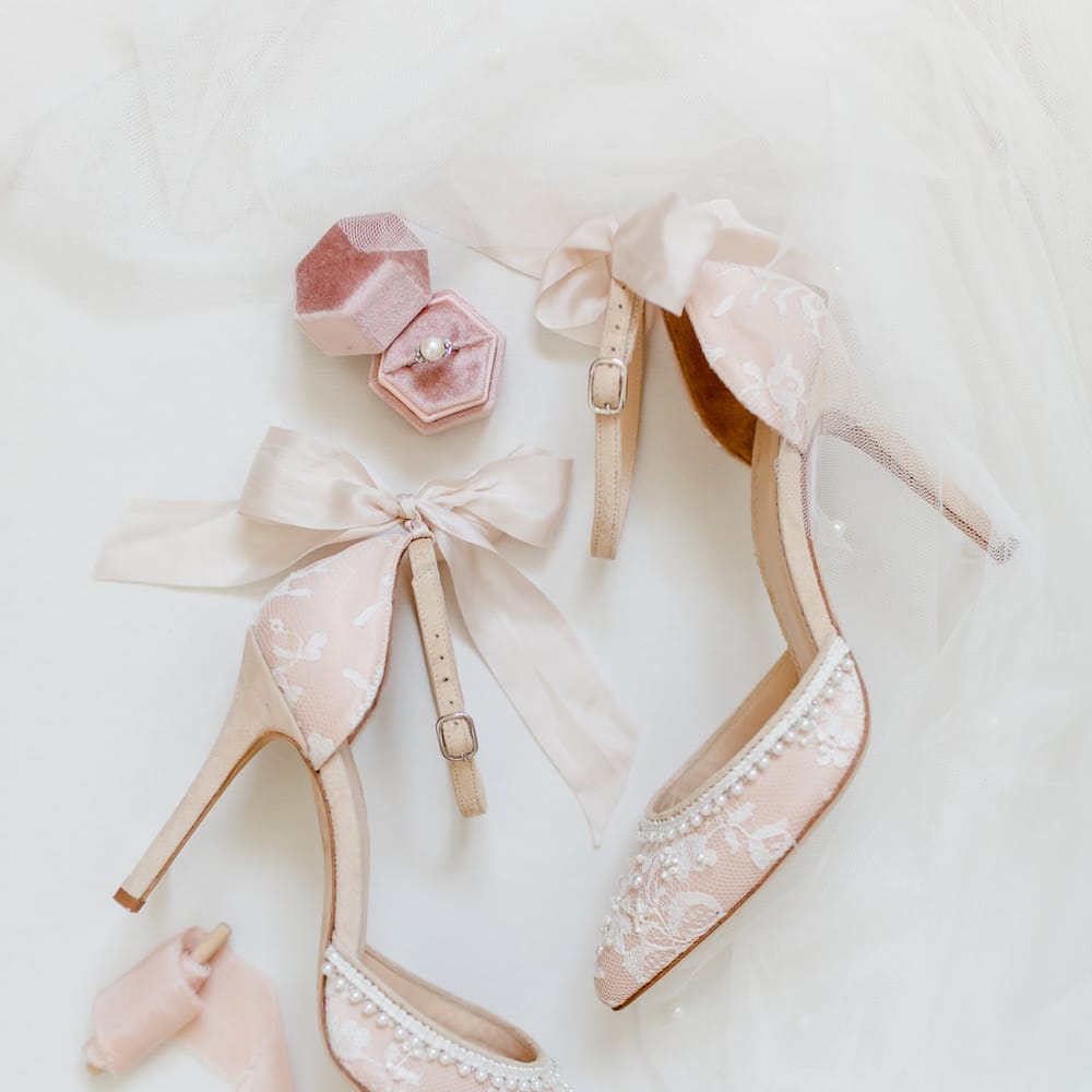 Blush pink wedding shoes with lace, ribbon and pearl detail 