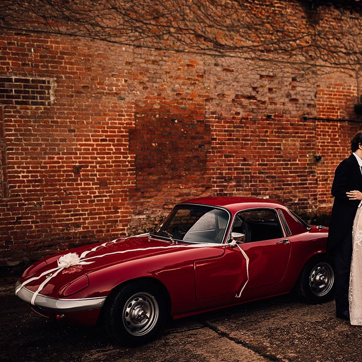 Vintage wedding car for bride at groom at Oxnead Hall venue in Norfolk