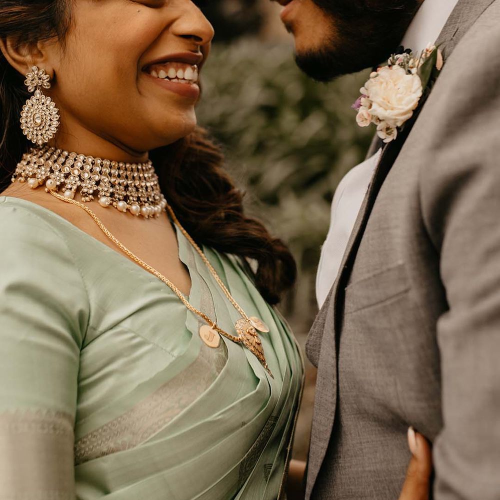Bride and groom embracing at their multicultural wedding